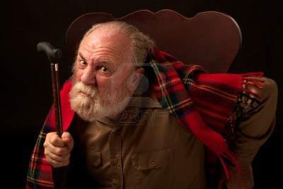 14570368-leaning-forward-in-his-chair-an-old-man-with-gray-beard-looks-directly-at-the-camera-fr.jpg
